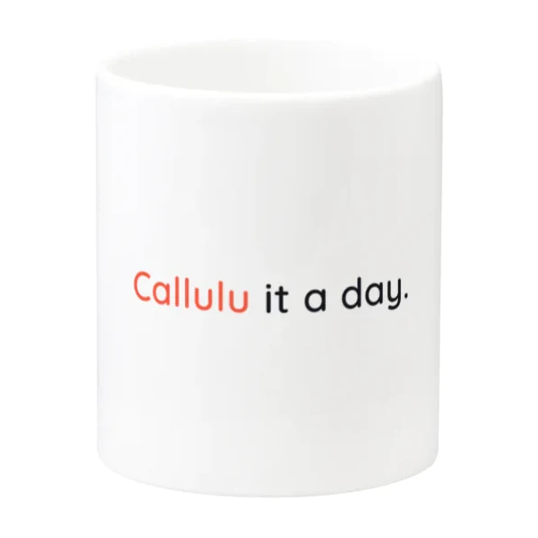 A white mug with the words “Callulu it a day.” printed across it, the word Callulu in orange.