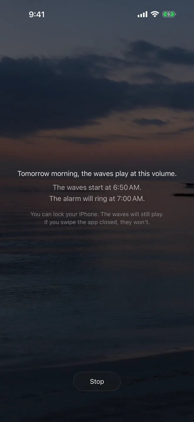 The dimmed screen after tapping Good night: tomorrow morning the waves play at this volume, the waves start at 6:50 AM, and the alarm will ring at 7:00 AM.